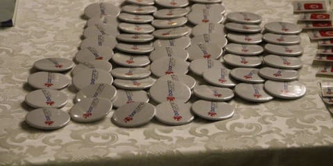 Stickers laid out in groups on the entrance table